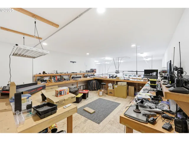 a view of a house with swimming pool and sitting area