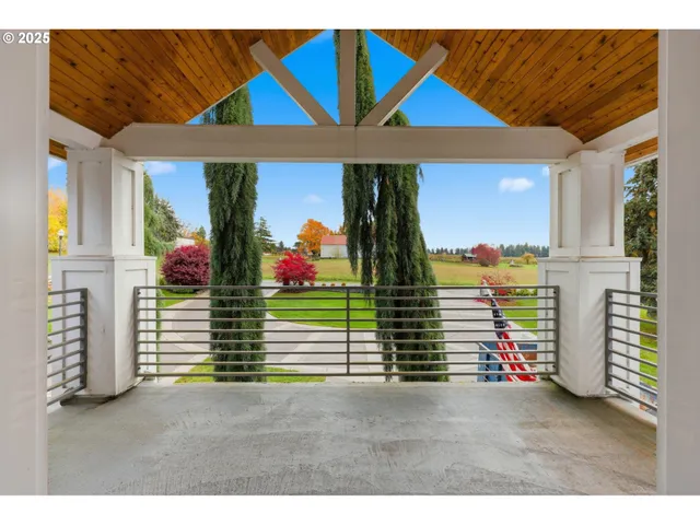 a view of house with garden space and trees
