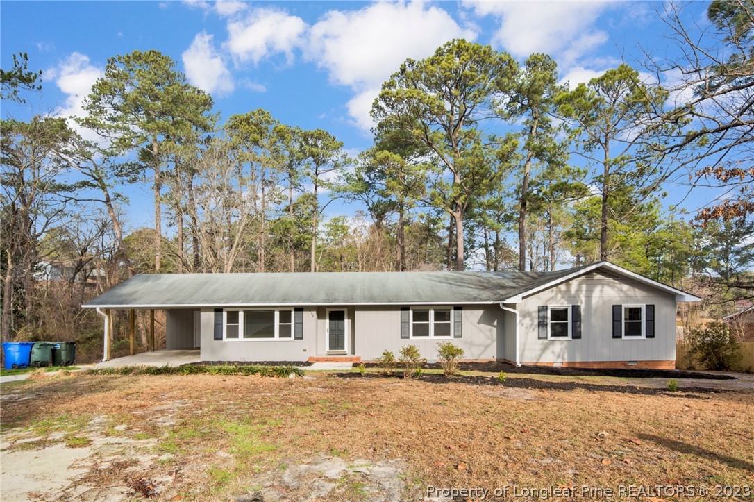 610 Arrowood Road Fayetteville, NC 28311 - Photo 1 of 26 a front view of a house with a yard