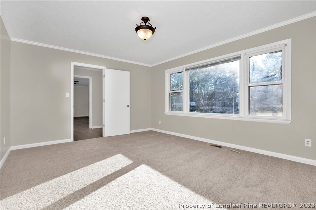 610 Arrowood Road Fayetteville, NC 28311 - Photo 12 of 26 a view of an empty room with a window