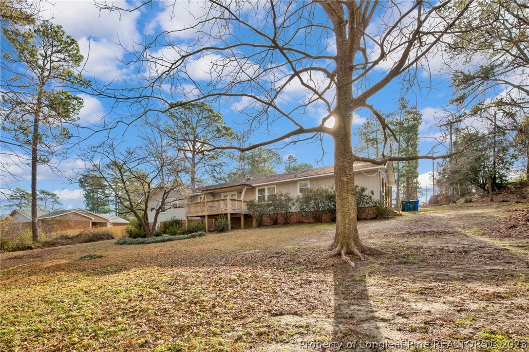 610 Arrowood Road Fayetteville, NC 28311 - Photo 5 of 26 a view of a yard with a tree