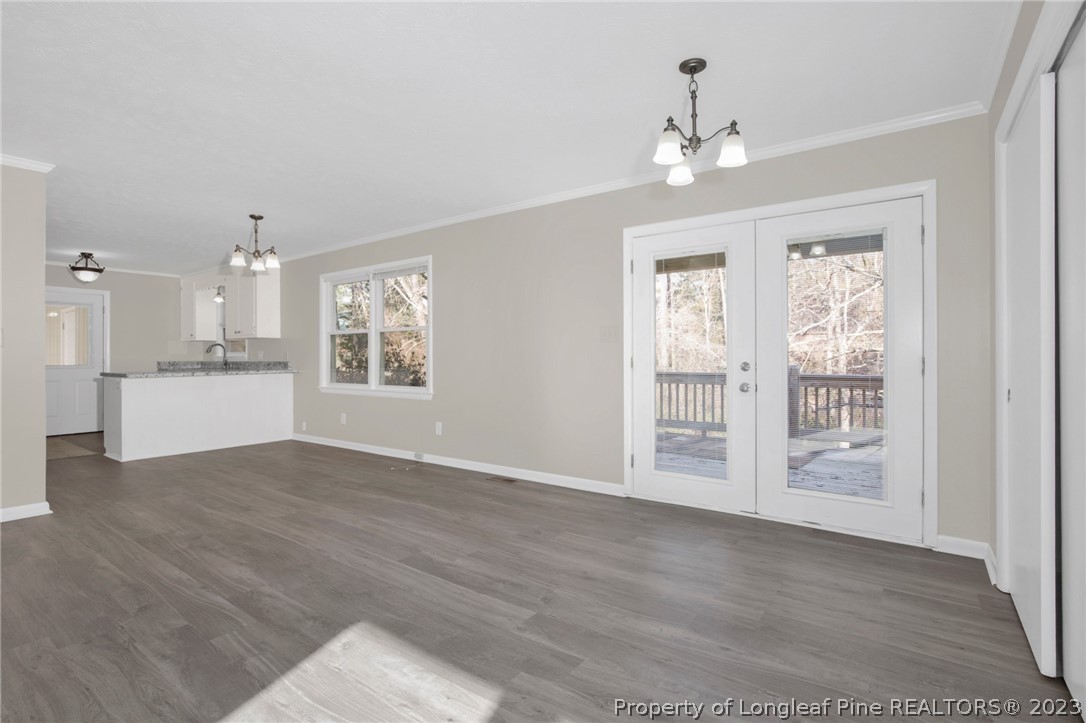 610 Arrowood Road Fayetteville, NC 28311 - Photo 7 of 26 a view of an empty room with a kitchen
