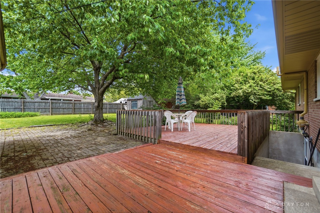 6119 Flemington Road Dayton, OH 45459 - Photo 62 of 76 This outdoor space offers a tiered deck and paved area, perfect for entertaining.
