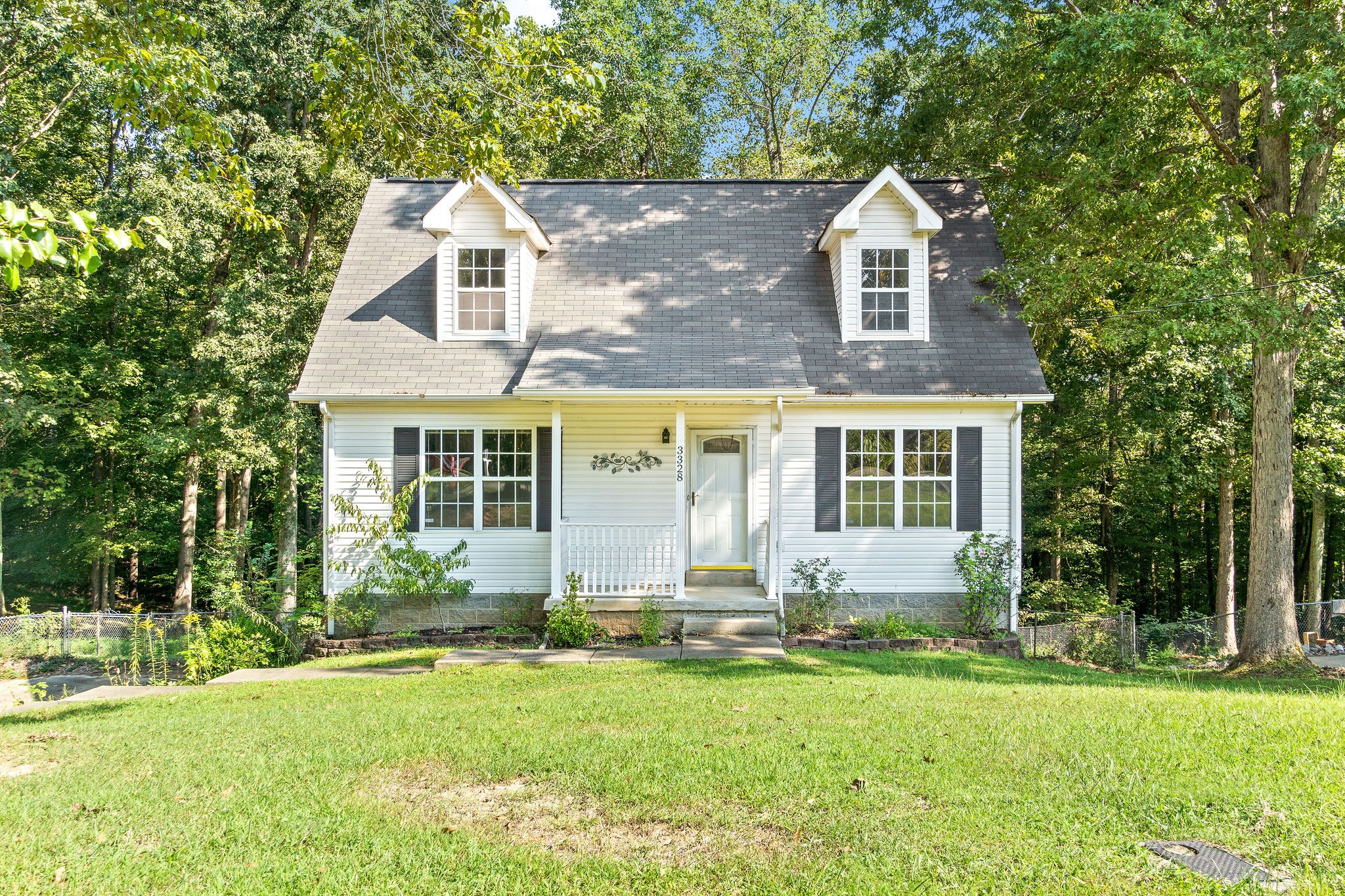 3328 Backridge Road Woodlawn, TN 37191 - Photo 1 of 28 a front view of house with yard and green space