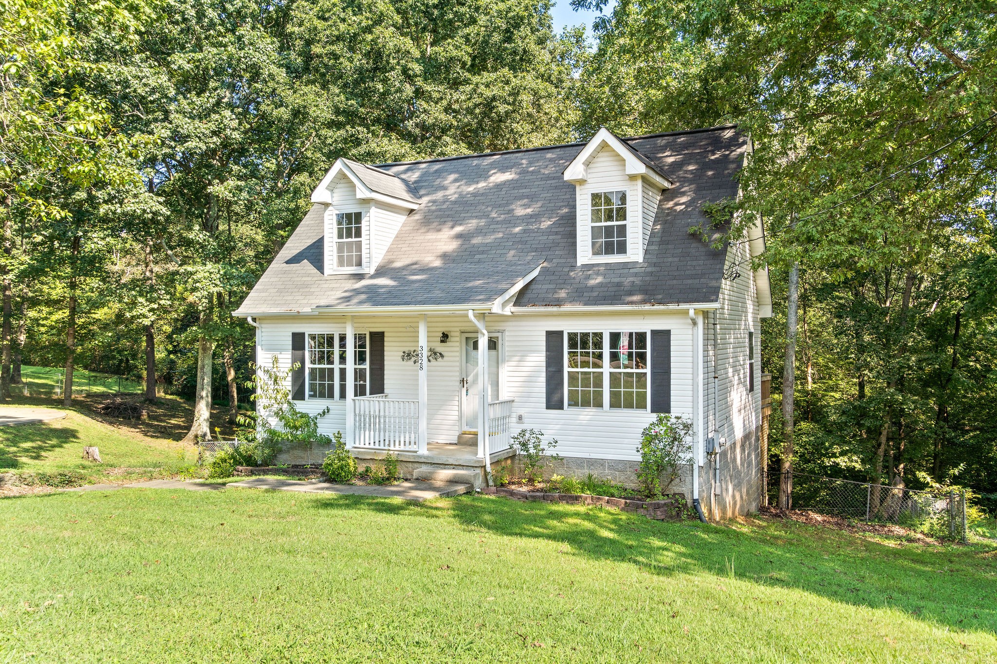3328 Backridge Road Woodlawn, TN 37191 - Photo 2 of 28 a front view of a house with a yard