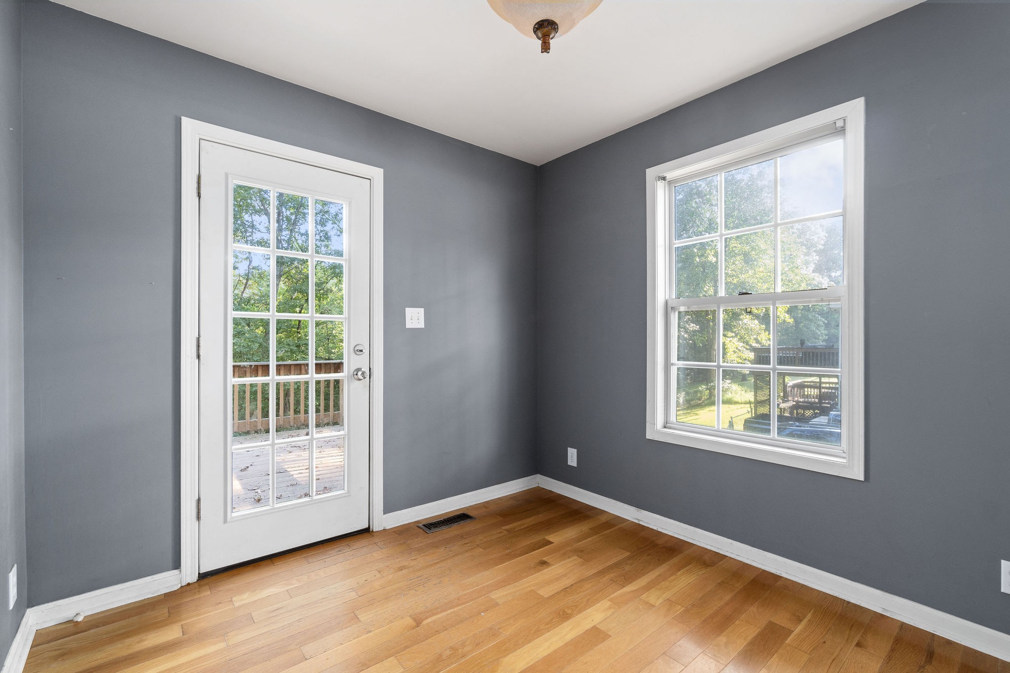 3328 Backridge Road Woodlawn, TN 37191 - Photo 11 of 28 a view of an empty room with wooden floor and a window