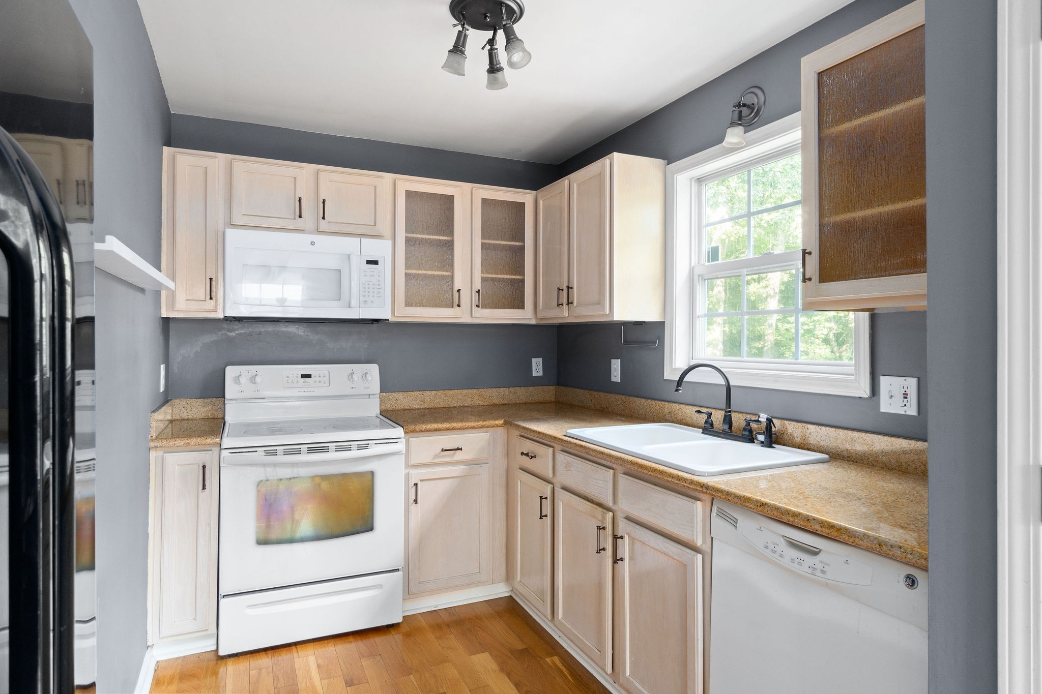 3328 Backridge Road Woodlawn, TN 37191 - Photo 12 of 28 a kitchen with a sink stove and cabinets
