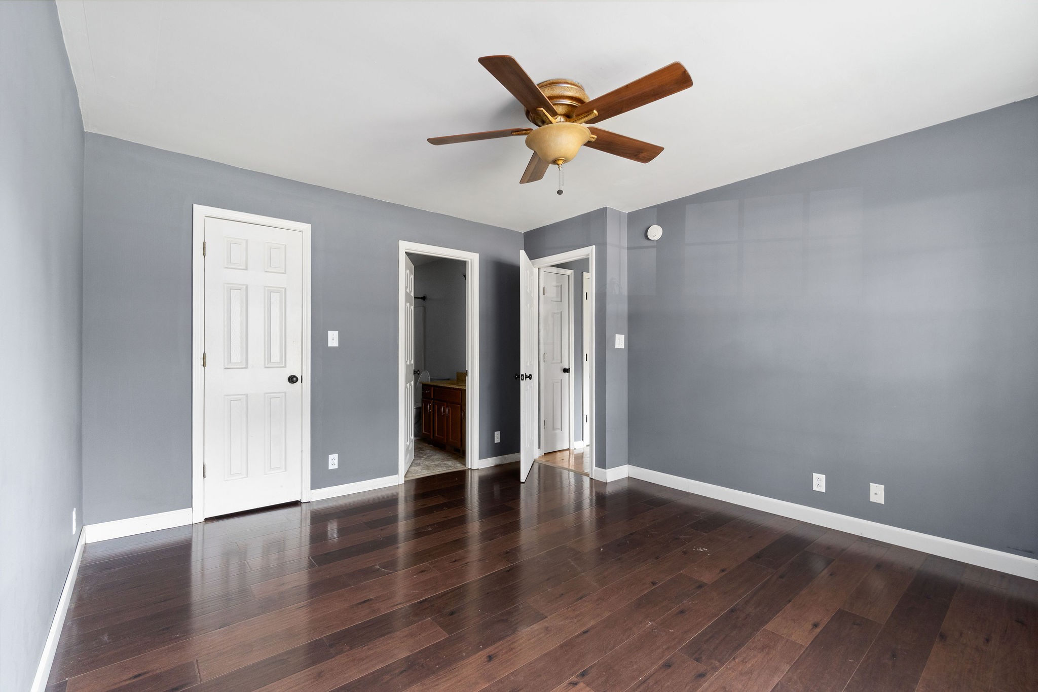 3328 Backridge Road Woodlawn, TN 37191 - Photo 16 of 28 an empty room with wooden floor and a ceiling fan