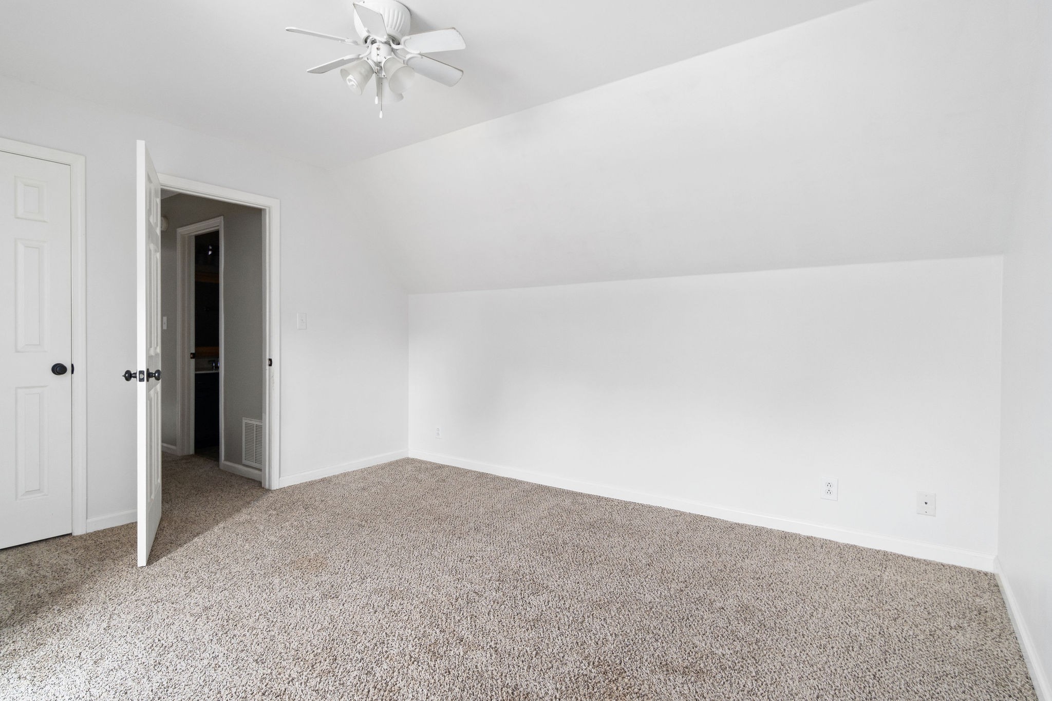 3328 Backridge Road Woodlawn, TN 37191 - Photo 22 of 28 an empty room with a ceiling fan and a window