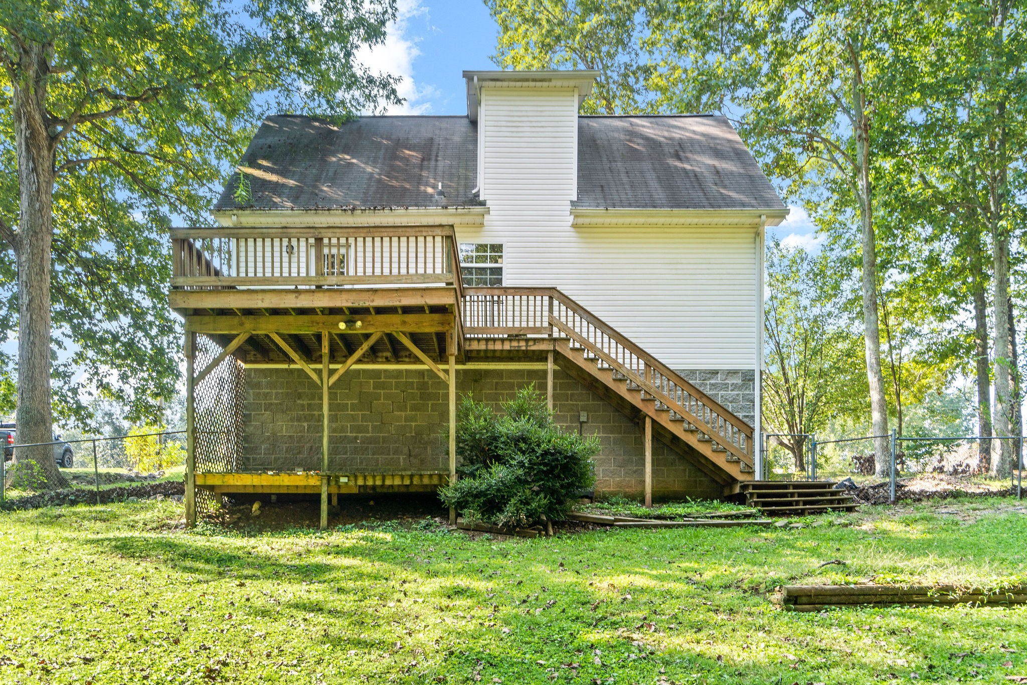 3328 Backridge Road Woodlawn, TN 37191 - Photo 26 of 28 a view of a house with a yard
