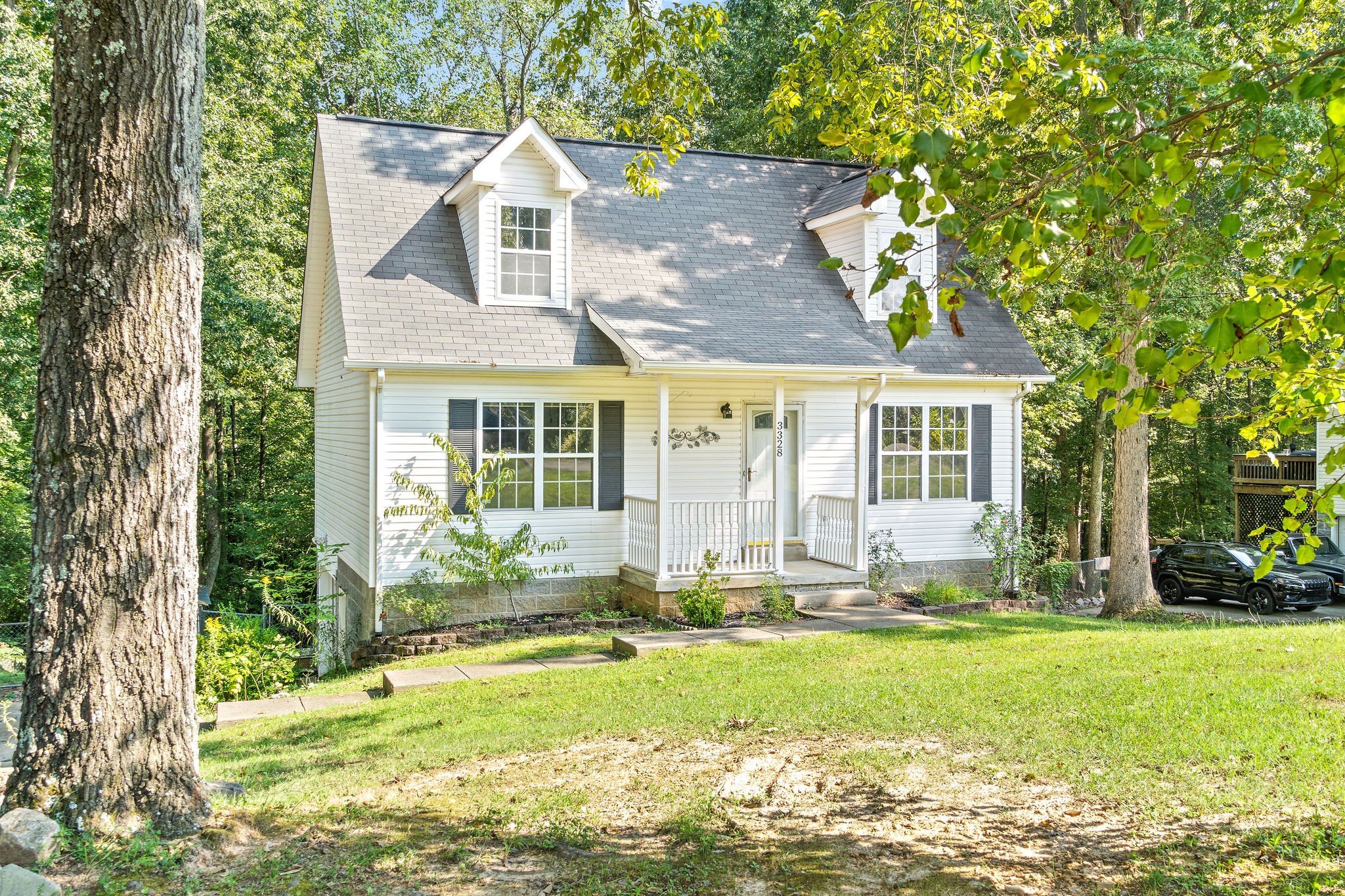 3328 Backridge Road Woodlawn, TN 37191 - Photo 4 of 28 a front view of a house with a yard