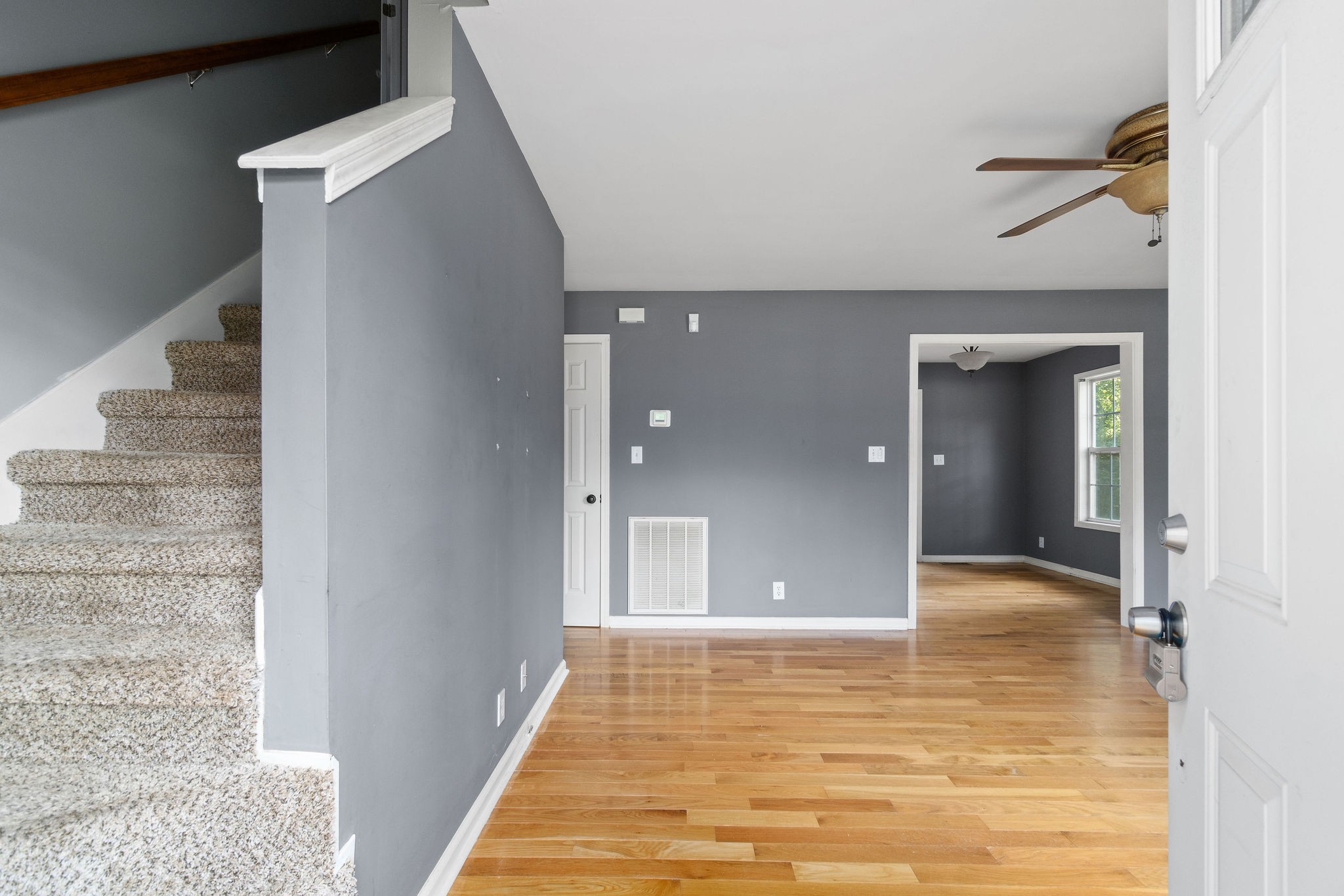 3328 Backridge Road Woodlawn, TN 37191 - Photo 5 of 28 a view of a hallway with wooden floor and staircase