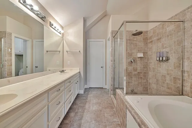 a bathroom with a double vanity sink toilet double vanity and shower