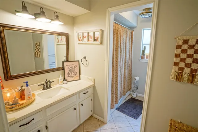 a bedroom with a bed and a bookshelf with wooden floor