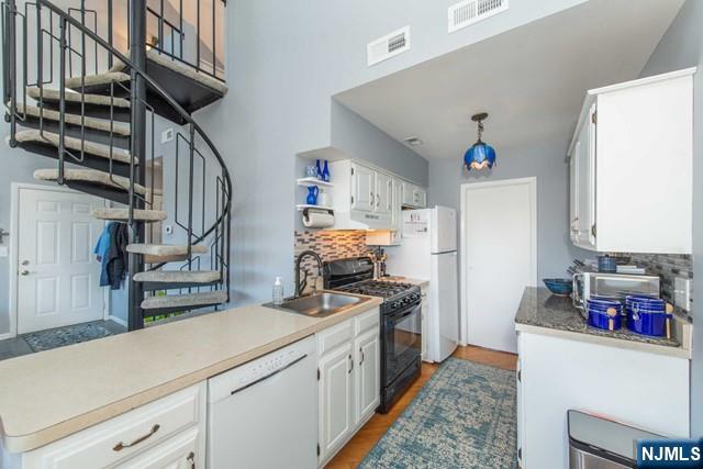 2 Falkenstein Drive, Unit 2 Vernon, NJ 07462 - Photo 11 of 24 a kitchen with stainless steel appliances granite countertop a sink dishwasher stove and refrigerator
