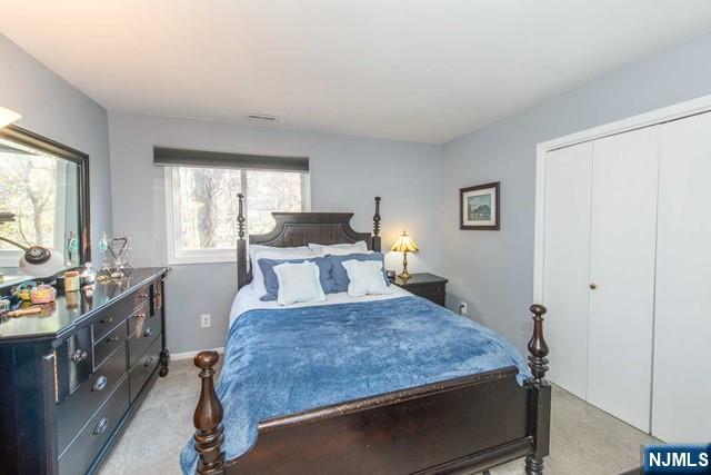 2 Falkenstein Drive, Unit 2 Vernon, NJ 07462 - Photo 12 of 24 a bedroom with a bed and a window