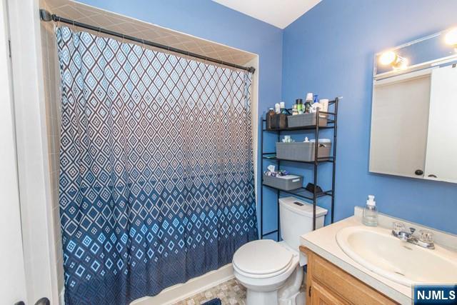 2 Falkenstein Drive, Unit 2 Vernon, NJ 07462 - Photo 14 of 24 a bathroom with a sink and a toilet