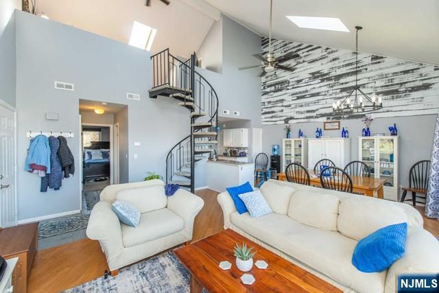 2 Falkenstein Drive, Unit 2 Vernon, NJ 07462 - Photo 4 of 24 a living room with furniture and a chandelier