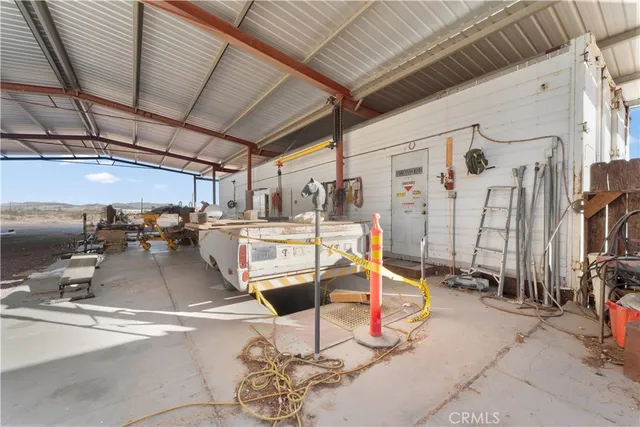 a view of a hallway with wooden walls and stairs