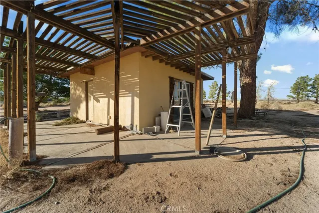 a view of a backyard of the house