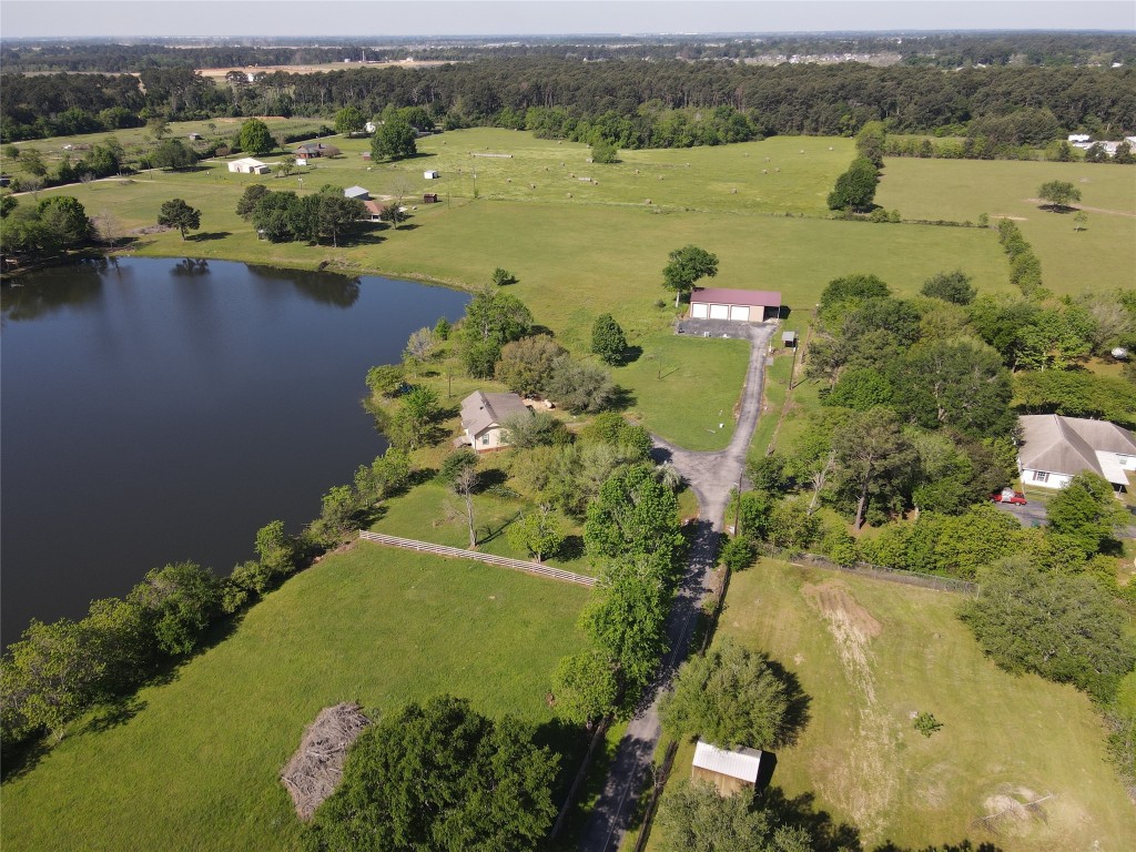 21645 Mueschke Road Tomball, TX 77377 - Photo 4 of 6 an aerial view of residential houses with outdoor space and lake view
