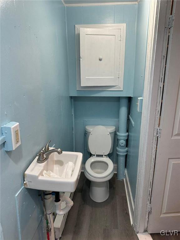 425 Liberty Street, Unit 1 Allentown, PA 18102 - Photo 11 of 13 a bathroom with a toilet sink and mirror
