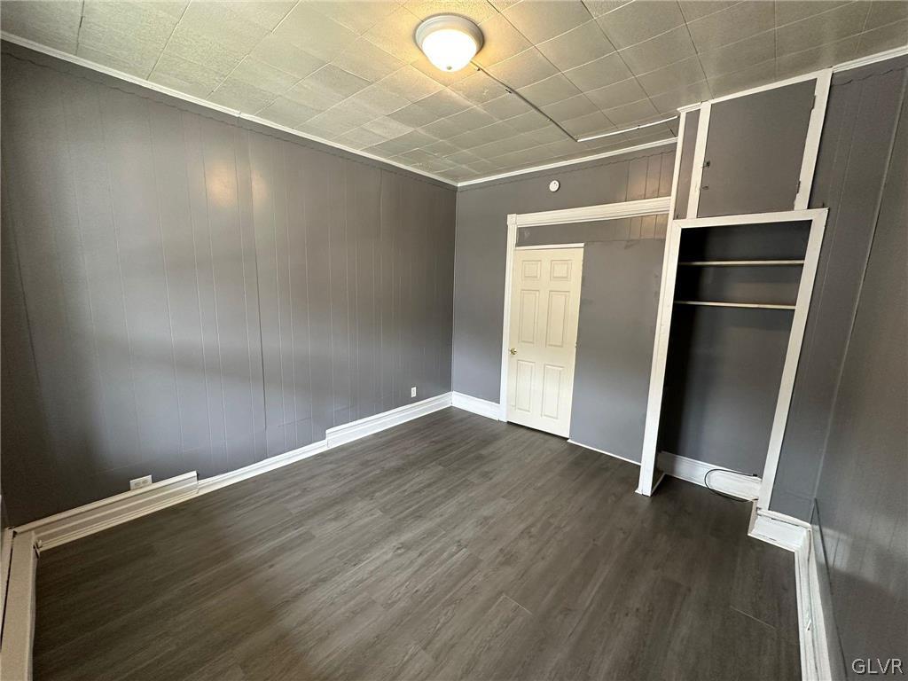 425 Liberty Street, Unit 1 Allentown, PA 18102 - Photo 9 of 13 a view of an empty room with wooden floor and a window