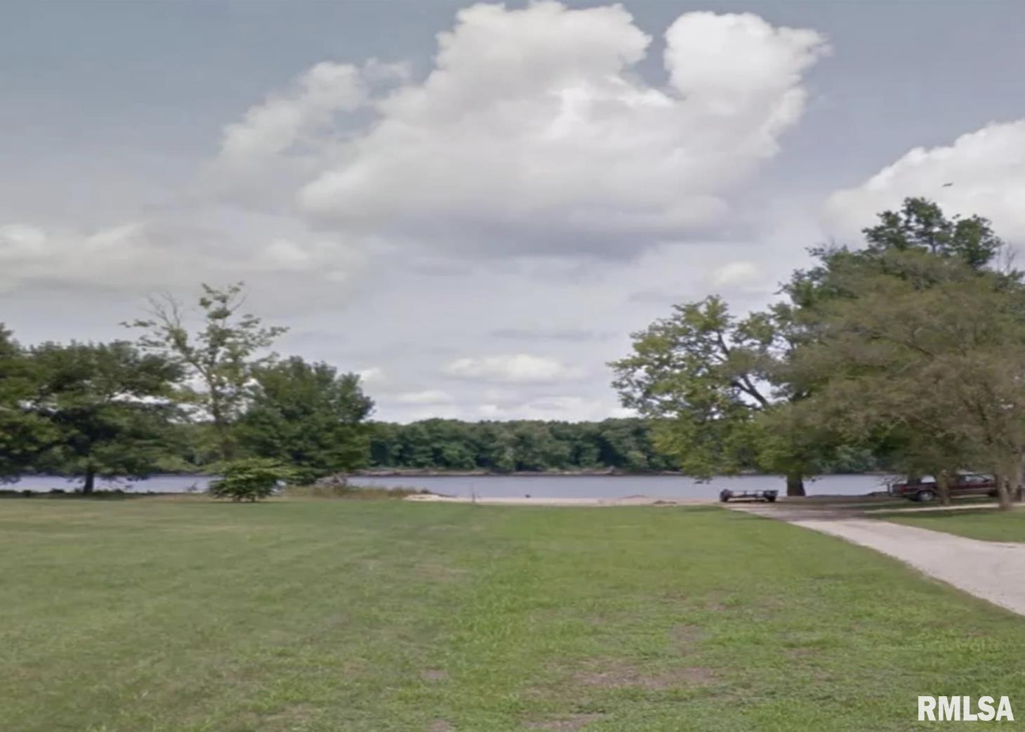 206 9th Avenue North Albany, IL 61230 - Photo 6 of 7 a view of a lake with houses in the back