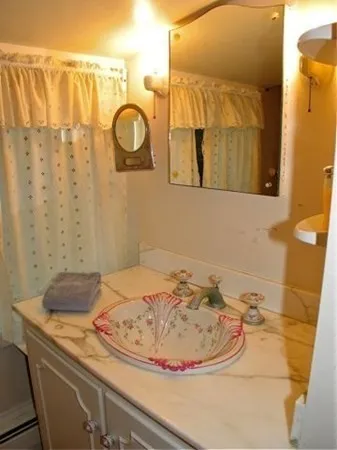 a bathroom with a sink and a mirror
