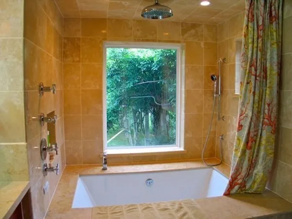 a bathroom with a bathtub and shower