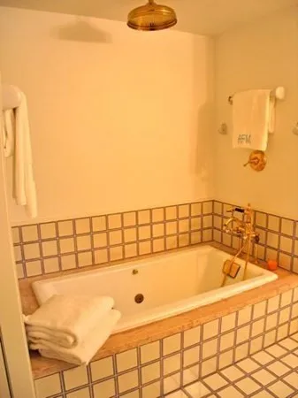 a bathroom with a bathtub and shower