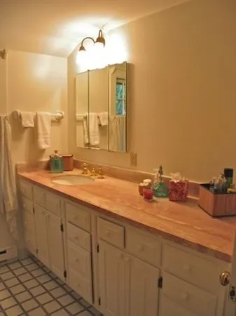 a bathroom with a sink and a mirror