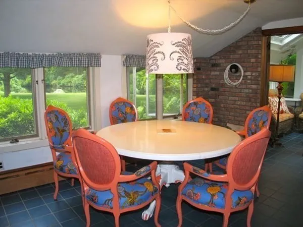 a view of a table and chairs under an umbrella