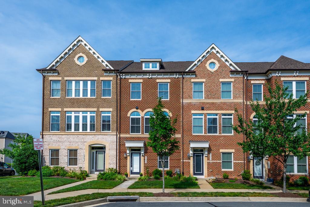 20649 Duxbury Terrace Ashburn, VA 20147 - Photo 1 of 41 a front view of a residential houses with yard and green space