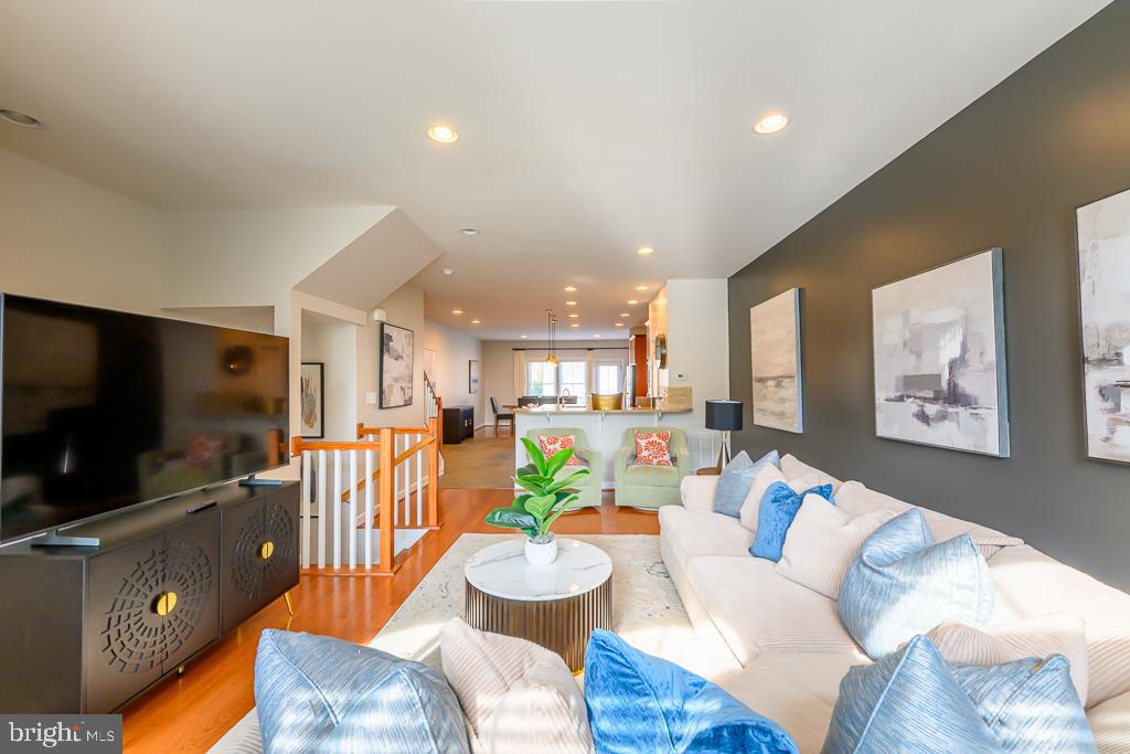 20649 Duxbury Terrace Ashburn, VA 20147 - Photo 11 of 41 a living room with furniture and a flat screen tv