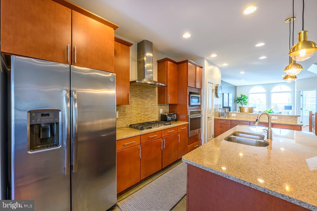 20649 Duxbury Terrace Ashburn, VA 20147 - Photo 13 of 41 a kitchen with stainless steel appliances granite countertop a refrigerator a oven and a sink