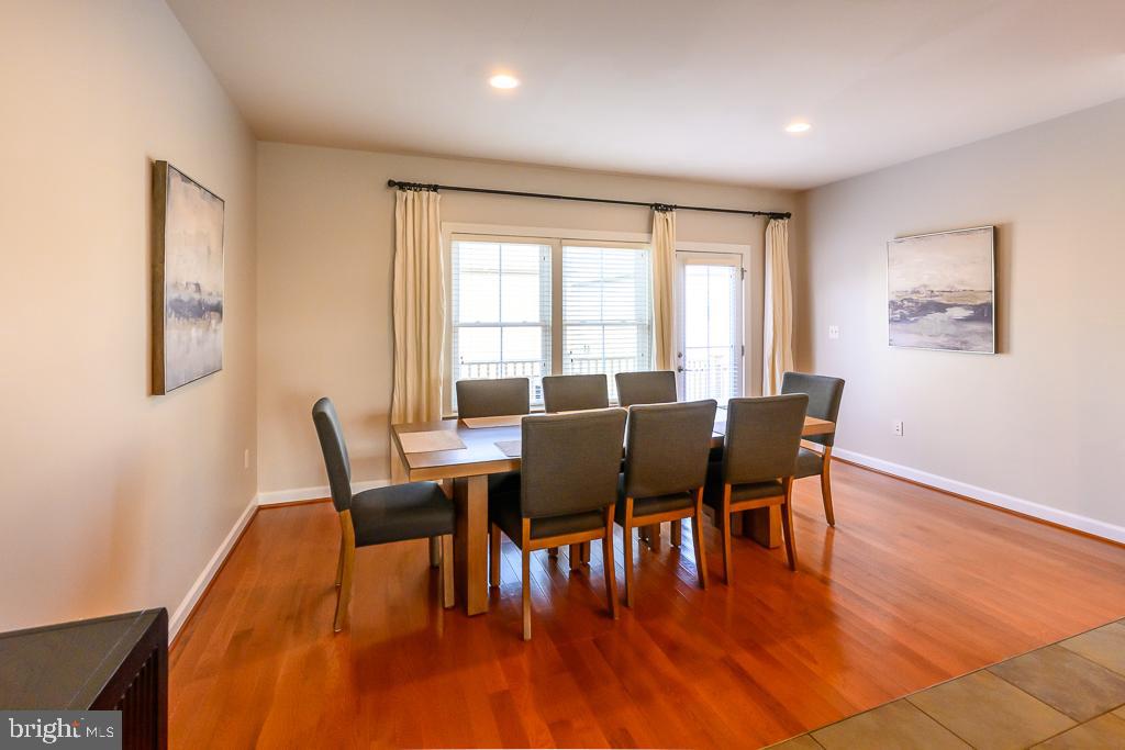 20649 Duxbury Terrace Ashburn, VA 20147 - Photo 15 of 41 a view of a dining room with furniture and wooden floor