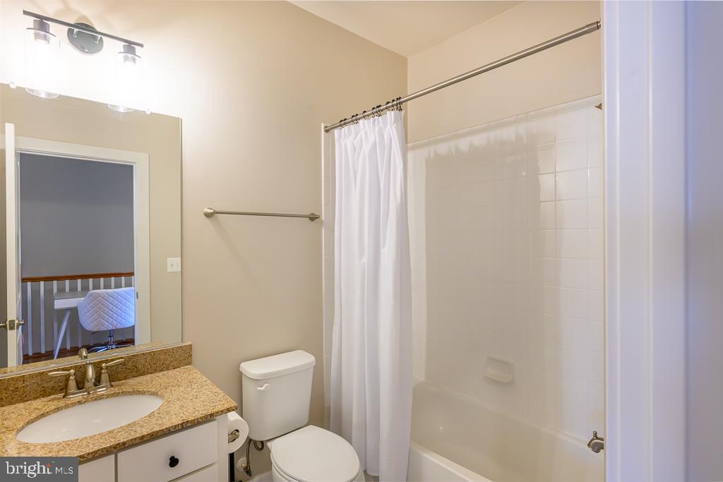 20649 Duxbury Terrace Ashburn, VA 20147 - Photo 22 of 41 a bathroom with a granite countertop sink toilet and shower