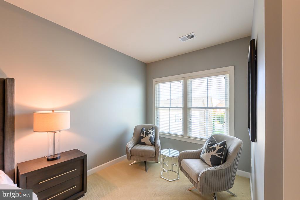20649 Duxbury Terrace Ashburn, VA 20147 - Photo 26 of 41 a living room with furniture and a window