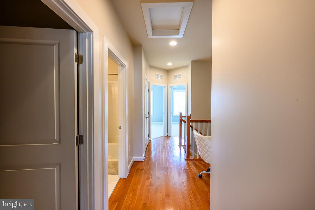 20649 Duxbury Terrace Ashburn, VA 20147 - Photo 30 of 41 a view of hallway with stairs and wooden floor