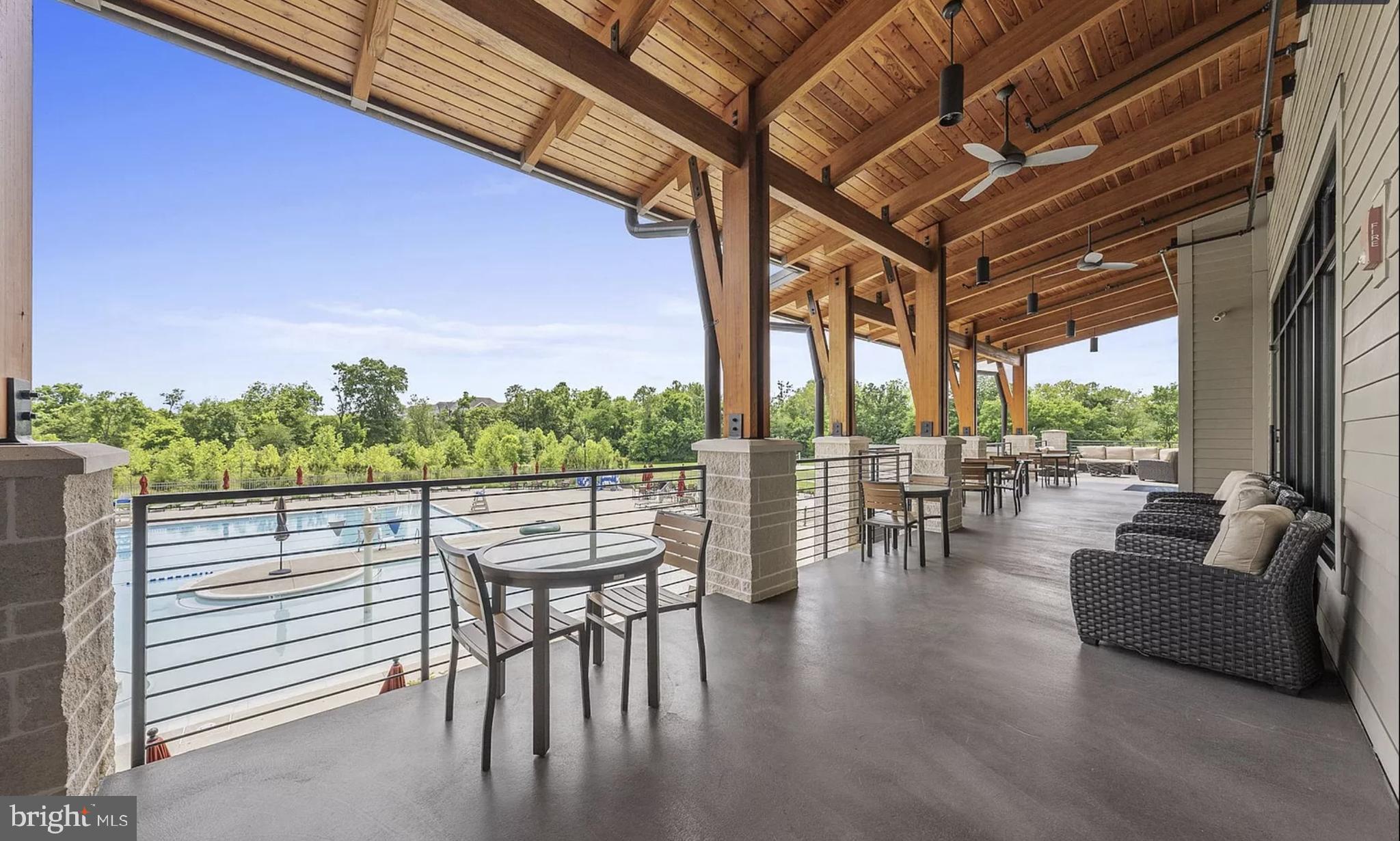 20649 Duxbury Terrace Ashburn, VA 20147 - Photo 34 of 41 a view of a chairs and table in patio with a yard