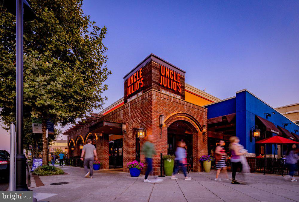 20649 Duxbury Terrace Ashburn, VA 20147 - Photo 38 of 41 a group of people sitting outside of a building