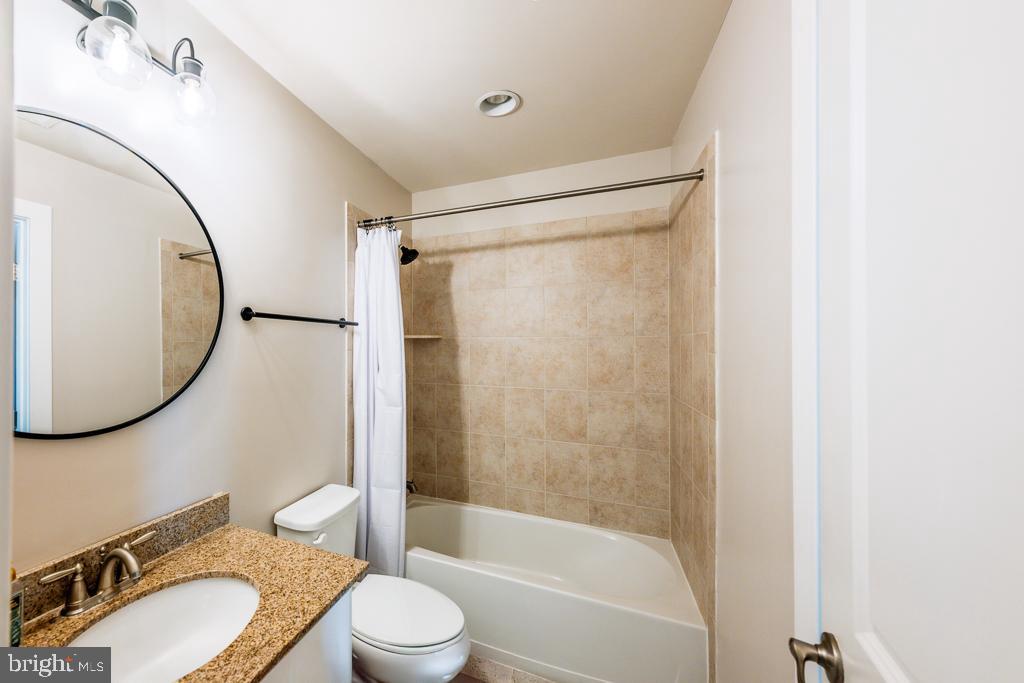 20649 Duxbury Terrace Ashburn, VA 20147 - Photo 6 of 41 a bathroom with a sink toilet and a mirror