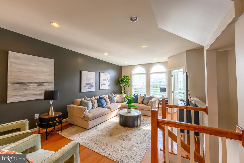 20649 Duxbury Terrace Ashburn, VA 20147 - Photo 8 of 41 a living room with furniture and a large window