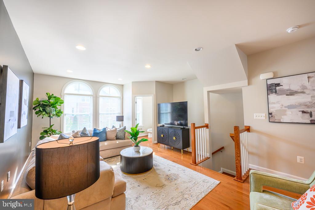 20649 Duxbury Terrace Ashburn, VA 20147 - Photo 9 of 41 a living room with furniture a window and a flat screen tv
