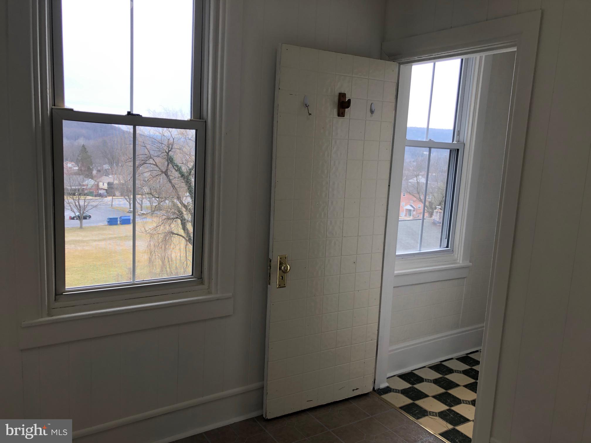 1035 Friedensburg Road Reading, PA 19606 - Photo 15 of 28 Den with vinyl floors and bathroom entrance
