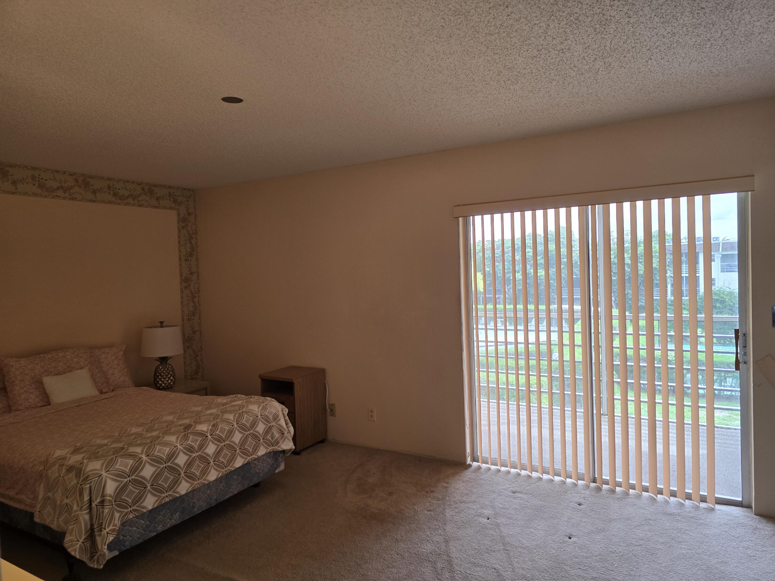 2100 Springdale Boulevard, Unit 306 Palm Springs, FL 33461 - Photo 13 of 21 sliders to patio