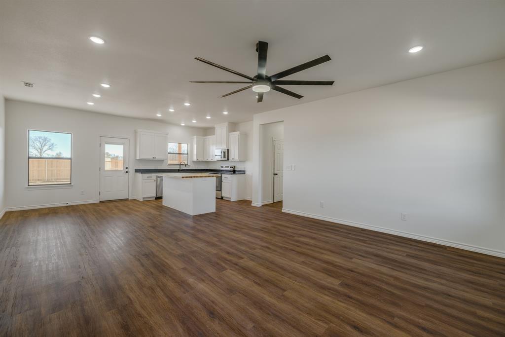 900 Ruger Drive Clyde, TX 79510 - Photo 2 of 11 wooden floor in an empty room with a window