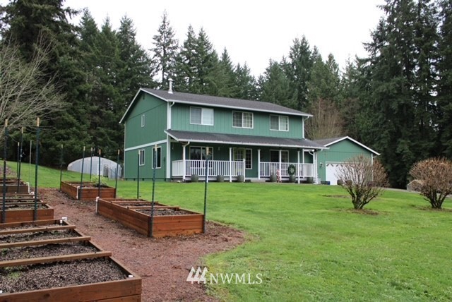 4910 193rd Lane Southwest Rochester, WA 98579 - Photo 1 of 25 a view of a house with a yard
