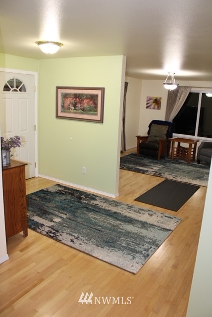 4910 193rd Lane Southwest Rochester, WA 98579 - Photo 11 of 25 a view of a livingroom with wooden floor